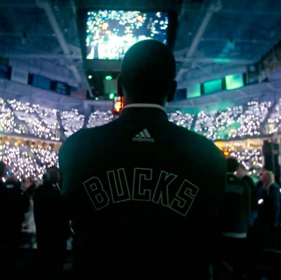 Milwaukee Bucks Khris Middleton coming out of the tunnel looking at the crowd