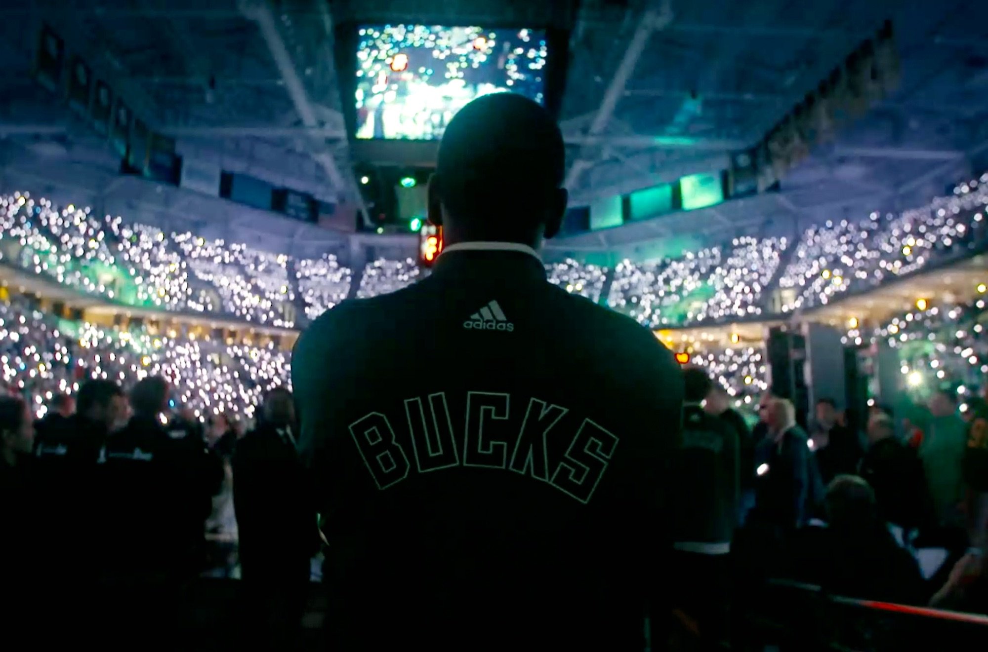 Milwaukee Bucks Khris Middleton coming out of the tunnel looking at the crowd