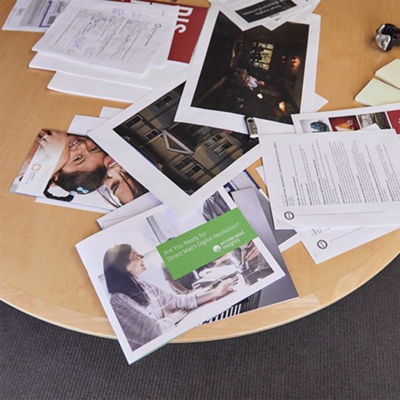 Accelerated Insights Table full of Paper Research